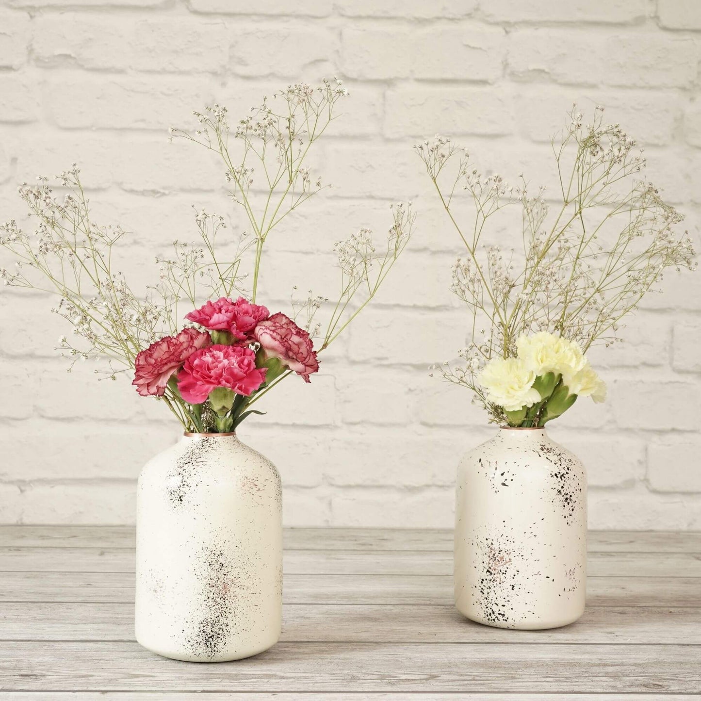 Spotted white flower vase with flowers 