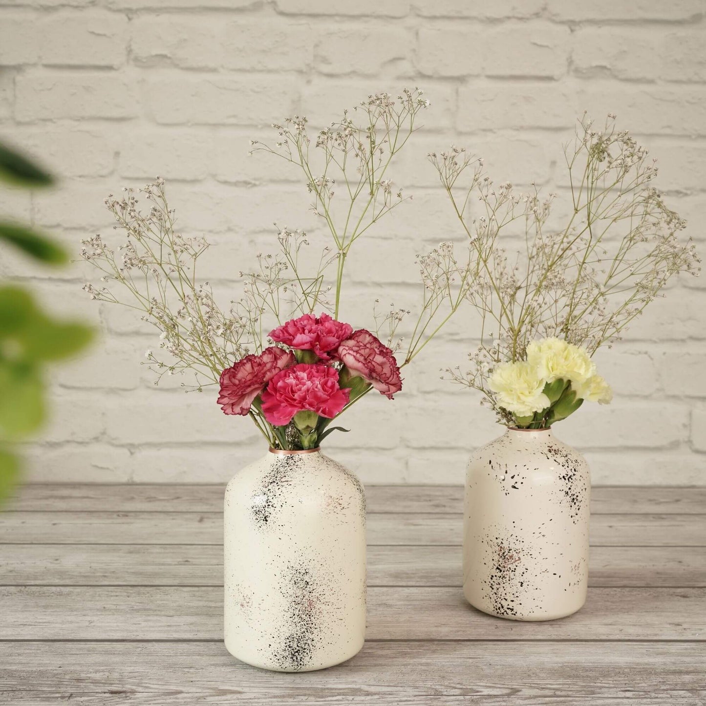 Spotted white flower vase with flowers 