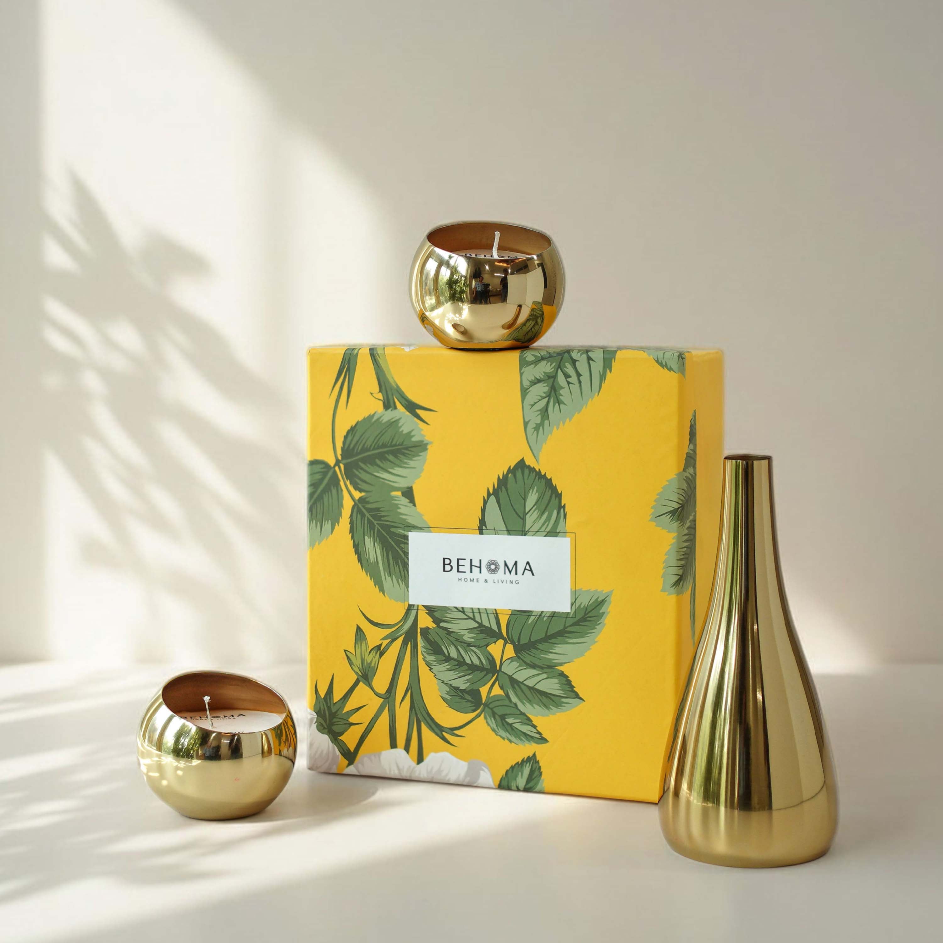 Gold candle holders and a decorative box with leaf design on a white surface, Golden Lights Gift Set