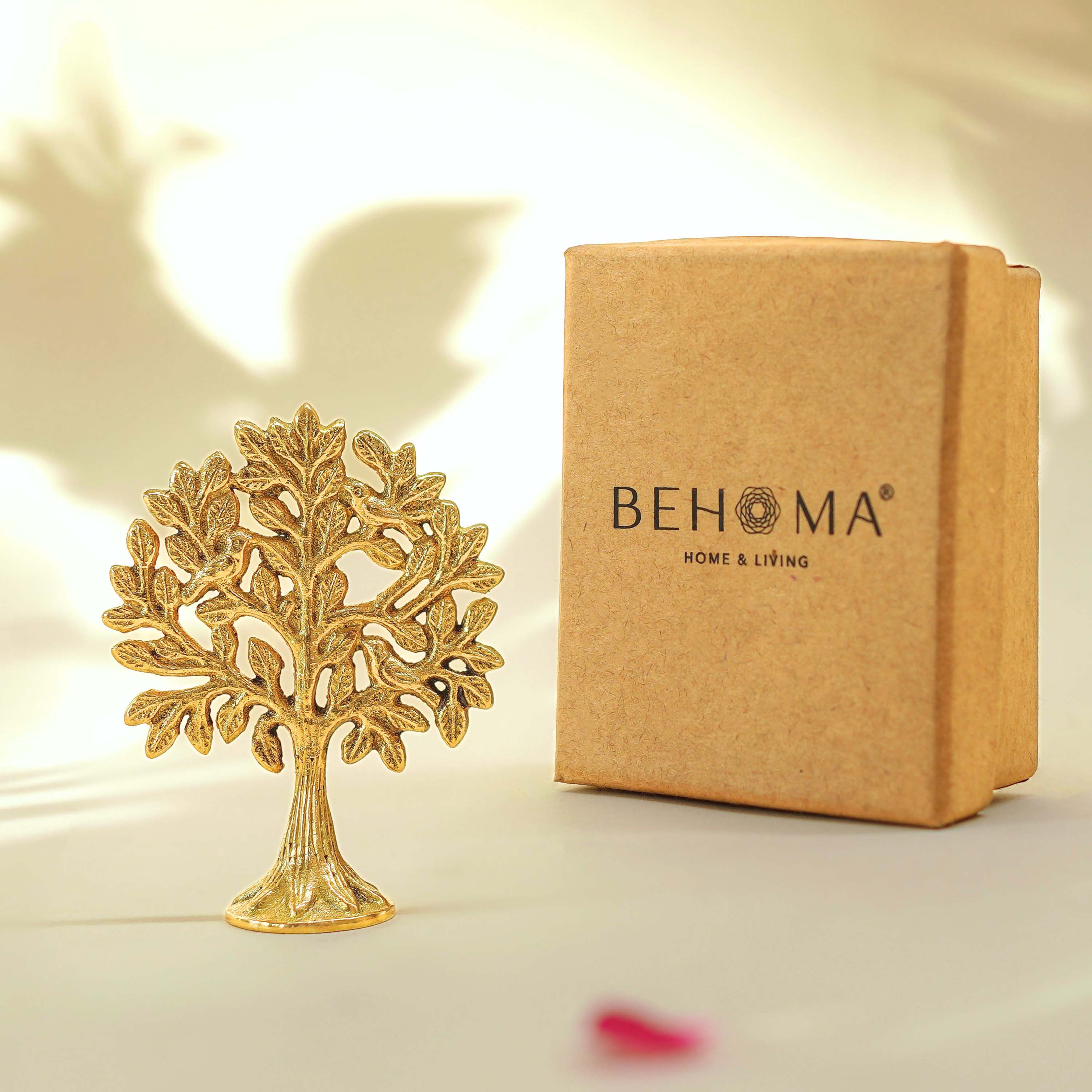 Decorative gold tree sculpture next to a Behoma branded box on a light background, Mini Brass Kalpvriksh
