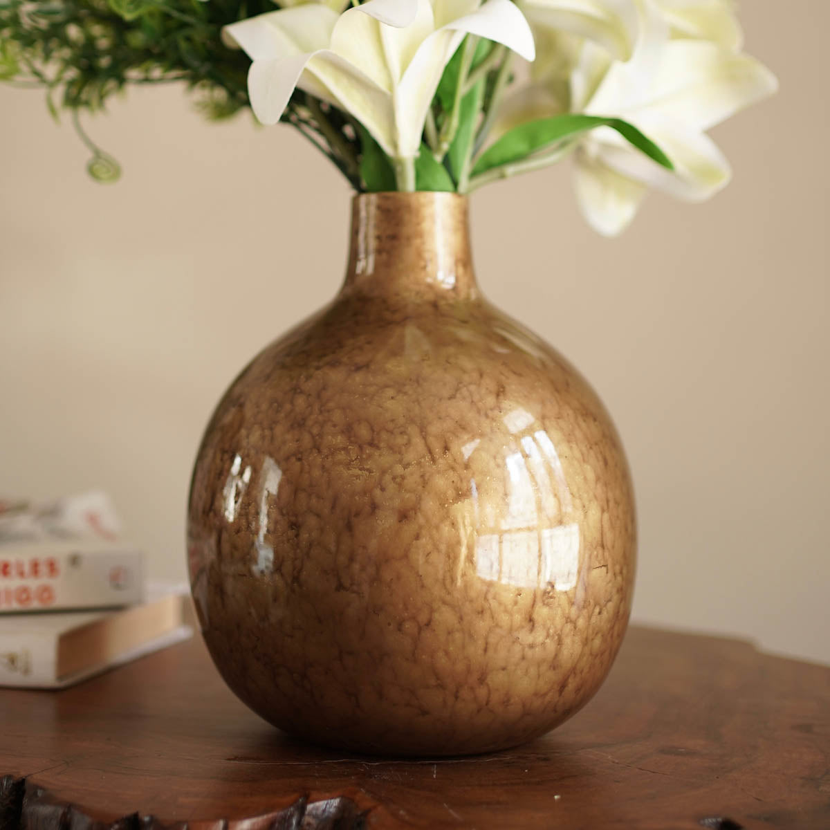 Antique gold flower vase with flowers